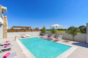 The swimming pool at or close to Villa Nikos Olivestone by Villa Plus
