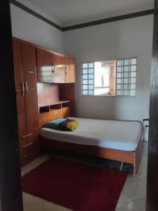 a bedroom with a large bed in a room at Hostel França - Quarto 3 in Montes Claros