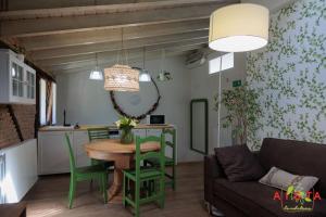 a living room with a table and a couch at AISTA Landetxea in Campanchu