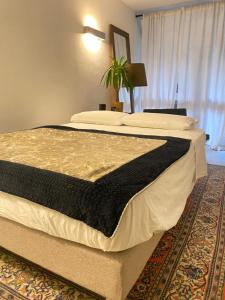 Postel nebo postele na pokoji v ubytování Suite con giardino Ravenna