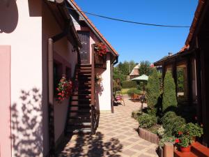 a stairway leading to a house with flowers on it at Apartment Najadka in Bobrovec