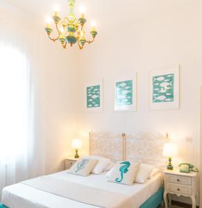 Postel nebo postele na pokoji v ubytování Hotel La Pineta Al Mare