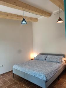 Ένα ή περισσότερα κρεβάτια σε δωμάτιο στο Agriturismo Al posto giusto +9 φωτογραφίες