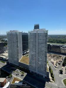 an aerial view of two tall buildings in a city at Skypark 1 with free parking in Bratislava