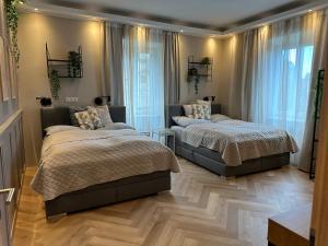 Łóżko lub łóżka w pokoju w obiekcie Book-A-Room Salzburg Apartment 33