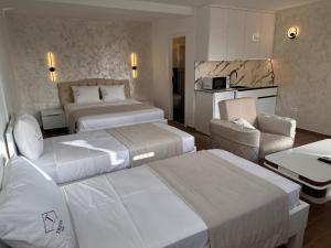 Postel nebo postele na pokoji v ubytování Treva Hotel & Apartaments