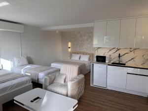 Postel nebo postele na pokoji v ubytování Treva Hotel & Apartaments