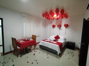 Postel nebo postele na pokoji v ubytování Hotel El Bosque Valledupar
