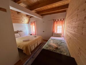 Postel nebo postele na pokoji v ubytování Guesthouse prek bjeshka