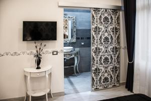 โทรทัศน์และ/หรือระบบความบันเทิงของ Dolci Mura Luxury Rooms