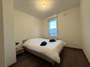 Ένα ή περισσότερα κρεβάτια σε δωμάτιο στο Grand T3 spacieux