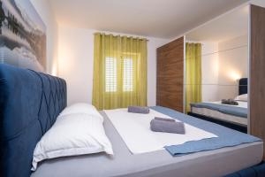 Postel nebo postele na pokoji v ubytování Apartment Dalmatino