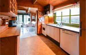 a kitchen with a sink and a counter top at Three-Bedroom Holiday Home In Roslev in Roslev