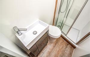a bathroom with a sink and a toilet at Amazing Ship In Hennigsdorf in Hennigsdorf +1 photo