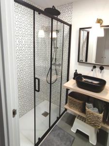 a bathroom with a glass shower with a sink at Casa Koala VT14462 in Pinto