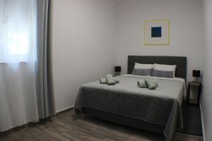 Ένα ή περισσότερα κρεβάτια σε δωμάτιο στο Sky Garden