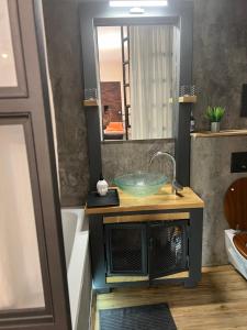 a bathroom with a sink and a mirror at Apartmány Veronika - Blansko in Blansko +27 photos