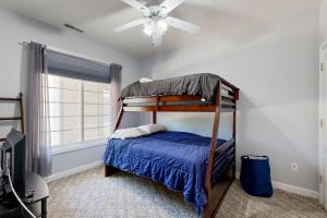 a bedroom with a bunk bed and a ceiling fan at Summerlyn Condo --- 34363 Summerlyn Dr 204 in Lewes