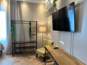 Televízia a/alebo spoločenská miestnosť v ubytovaní Book-A-Room Salzburg Apartment 31