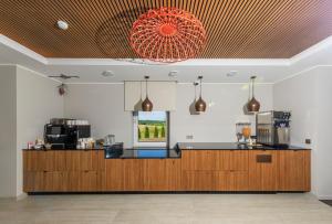 a kitchen with a counter and a window at Reiu Holiday Centre in Paikuse