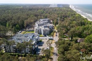 an aerial view of a large building next to the beach at Apartament Doris 2 - 50 m do plaży in Pobierowo