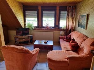 a living room with a couch and a table at Charmante Wohnung in Rheindiebach in Oberdiebach