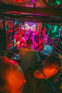 a group of people in a nightclub with a dj at Timeout Heritage Hotel Zagreb in Zagreb