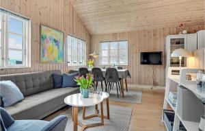 a living room with a couch and a table at Awesome Home In Mariager With Wifi in Mariager