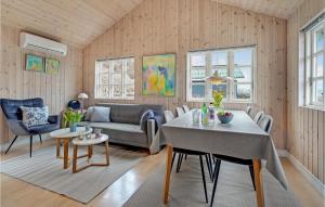 a living room with a couch and a table at Awesome Home In Mariager With Wifi in Mariager
