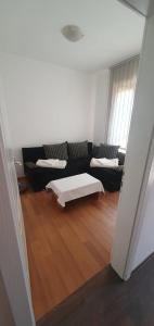 Postel nebo postele na pokoji v ubytování River Apartment