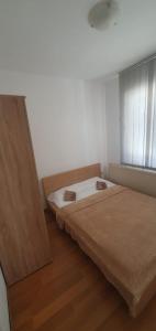 Postel nebo postele na pokoji v ubytování River Apartment + 1 fotografie