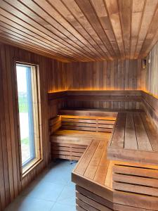 a sauna with wooden walls and a window at Anchorage Hotel & Spa in Torquay