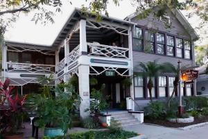 a house with a porch and a balcony at Old Powder House Inn in St. Augustine
