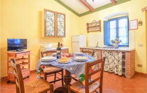 a kitchen with a table with a table cloth on it at 2 Bedroom Awesome Home In Casalappi in Casalappi