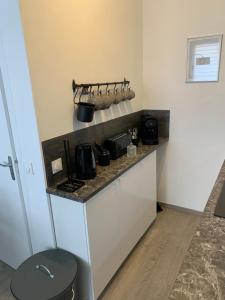 a kitchen with a counter with pots and pans at Studio Deauville in Deauville