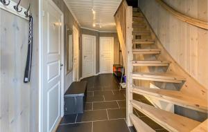 a hallway with a wooden staircase in a house at Amazing Home In Rauland With Wifi in Rauland +7 photos