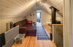 a living room with a couch and a fireplace at Amazing Home In Rauland With Wifi in Rauland