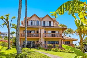 an image of a house with palm trees at Makanui 711 - Mountain View in Kipu