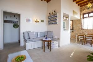 a living room with a couch and a table at Villa Electra in Halki +105 photos