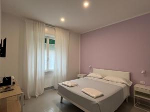 Postel nebo postele na pokoji v ubytování Bed and coffee Rooms Portoferraio