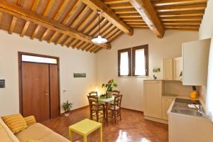 a living room with a couch and a table at La Fattoria di Tirrenia in Tirrenia