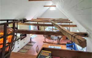 an attic room with a bunch of wooden stairs at 2 Bedroom Cozy Home In Munka Ljungby in Munka-Ljungby