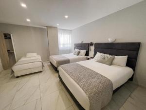 Uma cama ou camas num quarto em Hotel OR Suite