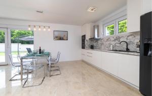 A kitchen or kitchenette at Nice Home In Kampor With Wifi