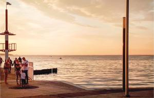 a group of people standing on a pier near the water at Amazing Home In Rechlin With Wifi in Rechlin