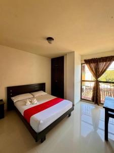 Postel nebo postele na pokoji v ubytování Hotel Portal Dorado