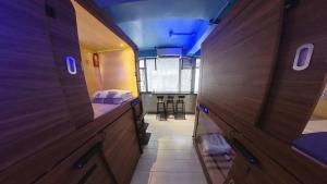 Tempat tidur dalam kamar di Starway Capsules