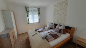 Posteľ alebo postele v izbe v ubytovaní BerBe Apartman