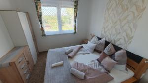 Posteľ alebo postele v izbe v ubytovaní BerBe Apartman