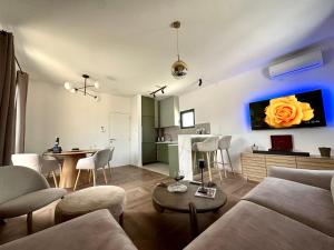 a living room with a couch and a table at Adriatic Dream in Tivat
